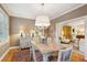 Formal dining room with marble table and view of living room at 14 Broughton Rd, Charleston, SC 29407