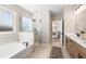 Spa-like bathroom featuring a soaking tub, walk-in shower, and double vanity at 141 Winding Grove Lane Ln, Moncks Corner, SC 29461