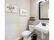 Simple bathroom with white vanity, toilet and framed art at 141 Winding Grove Lane Ln, Moncks Corner, SC 29461