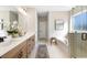 Elegant bathroom with double vanity, soaking tub, and walk-in shower at 141 Winding Grove Lane Ln, Moncks Corner, SC 29461