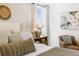 Bright bedroom with wood floors and a charming sitting area at 141 Winding Grove Lane Ln, Moncks Corner, SC 29461