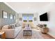 Cozy game room featuring a neutral sofa and a large TV at 141 Winding Grove Lane Ln, Moncks Corner, SC 29461
