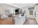 Open kitchen with white cabinets, island, and stainless steel appliances at 141 Winding Grove Lane Ln, Moncks Corner, SC 29461