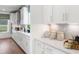 White kitchen with quartz countertops and gold hardware at 141 Winding Grove Lane Ln, Moncks Corner, SC 29461