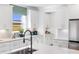 Open kitchen boasting white cabinets, quartz countertops and a black faucet at 141 Winding Grove Lane Ln, Moncks Corner, SC 29461