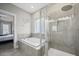 Bathroom with a soaking tub, walk-in shower, and gray tile flooring at 152 Callibluff Dr, Summerville, SC 29486