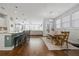 Open concept dining area with a farmhouse table and bench at 152 Callibluff Dr, Summerville, SC 29486