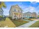 Two-story house with a welcoming front porch and nicely landscaped yard at 152 Callibluff Dr, Summerville, SC 29486