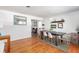 Bright dining room with hardwood floors and modern table set at 1569 Westwood Dr, Charleston, SC 29412