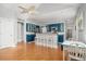 Kitchen with blue cabinets, stainless steel appliances, and hardwood floors at 1918 Chestnut Oak Ln, Charleston, SC 29414