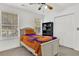 Bedroom with twin bed, bookcase, and ample closet space at 1960 Pinehurst Ave, Charleston, SC 29414