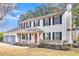 Two-story house with a red door, gray shutters, and a brick walkway at 1960 Pinehurst Ave, Charleston, SC 29414