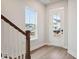 Bright entryway with hardwood floors, staircase, and front door at 199 Denham St, Summerville, SC 29486