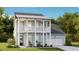 Two-story light blue house with white accents, balcony, and two-car garage at 199 Denham St, Summerville, SC 29486
