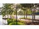 Serene lakeside view with a wooden dock and lush greenery at 199 Denham St, Summerville, SC 29486
