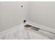 Laundry room with marble tile flooring and white walls at 199 Denham St, Summerville, SC 29486