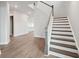 Elegant staircase with wooden railings and hardwood floors at 199 Denham St, Summerville, SC 29486