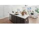 Modern kitchen with island, quartz countertops, stainless steel appliances, and hardwood floors at 211 Abercom Place Dr, Moncks Corner, SC 29461