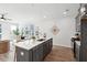 Modern kitchen with island, quartz countertops and stainless steel appliances at 211 Abercom Place Dr, Moncks Corner, SC 29461