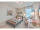 Cozy bedroom with a bed, chair, and decorative art at 216 Bumble Way, Summerville, SC 29485