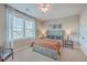 Bright bedroom with a queen bed, two windows, and a ceiling fan at 216 Bumble Way, Summerville, SC 29485