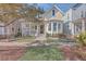 Charming craftsman style home with a welcoming front porch and manicured landscaping at 216 Bumble Way, Summerville, SC 29485