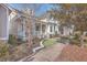 House exterior showcasing a charming front porch and neatly landscaped yard at 216 Bumble Way, Summerville, SC 29485