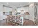 Modern kitchen with white cabinets, granite countertops, and stainless steel appliances at 216 Bumble Way, Summerville, SC 29485