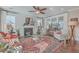 Living room with fireplace, hardwood floors, and abundant natural light at 216 Bumble Way, Summerville, SC 29485