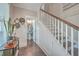 Elegant staircase with a white railing and hardwood steps at 216 Bumble Way, Summerville, SC 29485
