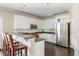 Modern kitchen with white cabinets, stainless steel appliances, and an island at 2274 Sandy Point Ln, Mount Pleasant, SC 29466