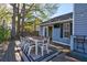 Deck with dining table, string lights, and adjacent to house at 228 Muirfield Pkwy, Charleston, SC 29414