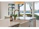 Elegant kitchen with farmhouse sink, marble counters, and a bright, open feel at 2281 Portside Way, Charleston, SC 29407