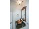 Small bathroom with granite vanity and decorative mirror at 2336 Parkstone Dr, Charleston, SC 29414