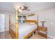 Main bedroom with a ceiling fan and large wooden bed frame at 2336 Parkstone Dr, Charleston, SC 29414
