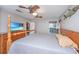 Main bedroom with TV, dresser, and wooden bed frame at 2336 Parkstone Dr, Charleston, SC 29414