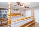Main bedroom with ceiling fan and large wooden bed frame at 2336 Parkstone Dr, Charleston, SC 29414