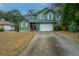 Two-story green house with driveway at 2336 Parkstone Dr, Charleston, SC 29414