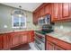 Modern kitchen with granite counters, stainless steel appliances and wood cabinets at 2336 Parkstone Dr, Charleston, SC 29414