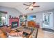 Living room features a fireplace, large screen TV, and leather sofa at 2336 Parkstone Dr, Charleston, SC 29414