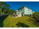 Spacious backyard with a large lawn, patio, and grilling area at 2910 Clearwater Dr, Mount Pleasant, SC 29466