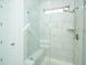 Modern bathroom with walk-in shower, marble tile, and built-in seat at 2910 Clearwater Dr, Mount Pleasant, SC 29466
