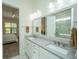 Double vanity bathroom with gray countertop and walk-in shower at 2910 Clearwater Dr, Mount Pleasant, SC 29466