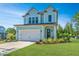 Beautiful two-story house with a large garage and well-manicured lawn at 2910 Clearwater Dr, Mount Pleasant, SC 29466