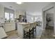 Modern kitchen with white cabinets, island, and stainless steel appliances at 305 Catawba Dr, Summerville, SC 29483