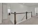 Spacious upstairs hallway with neutral carpeting and natural light at 307 Blue Oak Dr, Moncks Corner, SC 29461