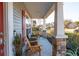 Relaxing front porch with wooden chairs and view of street at 3223 Dunwick Dr, Johns Island, SC 29455