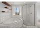 Bathroom with soaking tub, walk-in shower, and floating shelves at 339 Spectrum Rd, Summerville, SC 29486