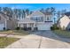 Two-story house with gray siding, stone accents, and a two-car garage at 339 Spectrum Rd, Summerville, SC 29486