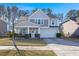 Two-story house with gray siding, stone accents, and a two-car garage at 339 Spectrum Rd, Summerville, SC 29486